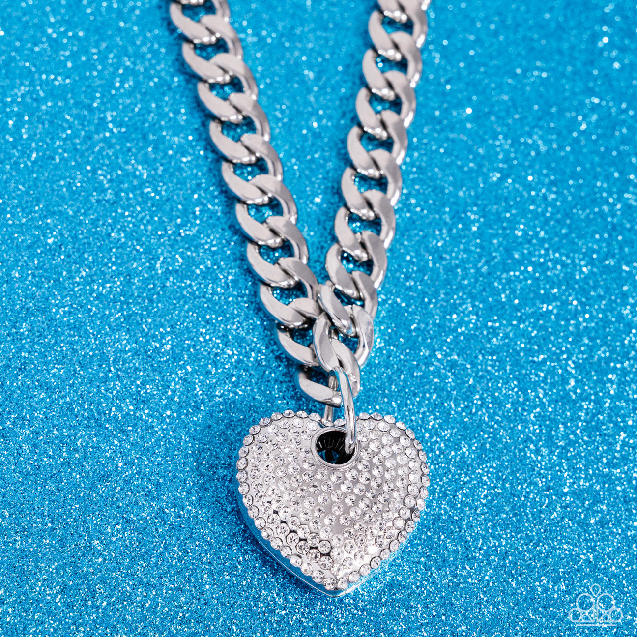 Ardent Affection White Heart Necklace - Paparazzi Accessories Featuring an intense white rhinestone embellishment, an oversized silver heart frame swings from the bottom of a thick silver curb chain for an edgy declaration. Features an adjustable clasp closure. Sold as one individual necklace. Includes one pair of matching earrings. SKU: P2ST-WTXX-138XX *LOP January 2024