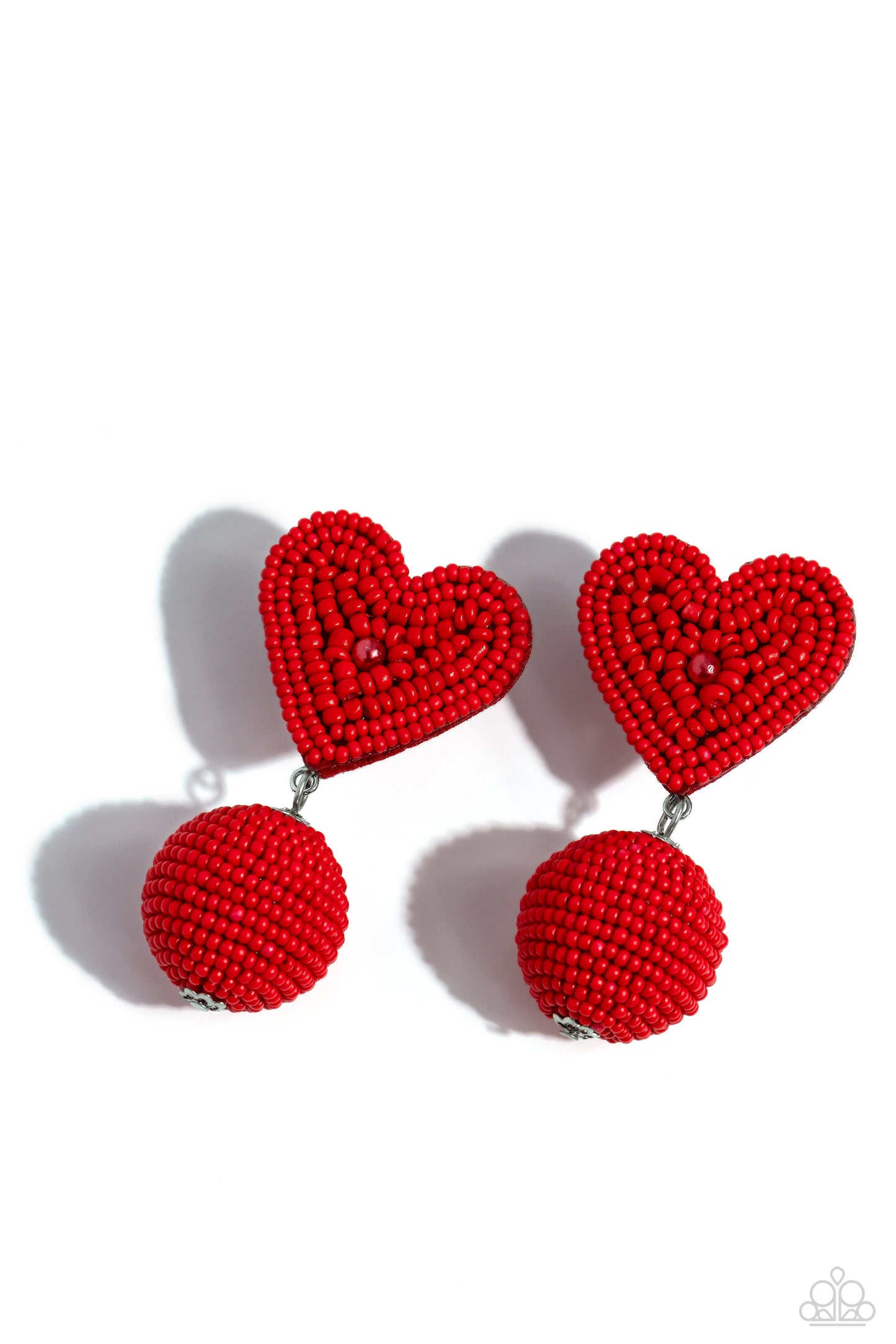 Spherical Sweethearts Red Heart Post Earring - Paparazzi Accessories Featuring a red pearl center, a red seed bead heart frame gives way to strands of red seed beads that decoratively spin around a spherical frame, resulting in a colorful three-dimensional display. Earring attaches to a standard post fitting. Sold as one pair of post earrings. P5PO-RDXX-042XX