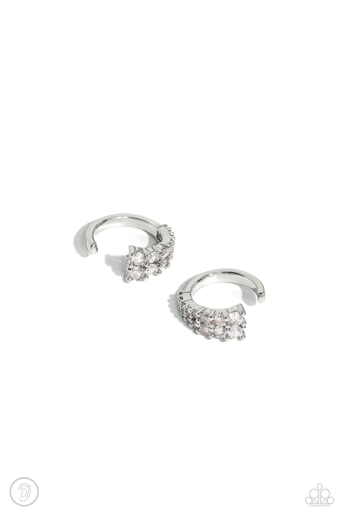 Pronged Parisian White Ear Cuff Earring - Paparazzi Accessories Featuring a two-pronged fitting, white rhinestones with a light iridescent sheen gradually decrease in size to create a blinding, adjustable, one-size-fits-all cuff. Sold as one pair of cuff earrings. P5PO-CFWT-389XX