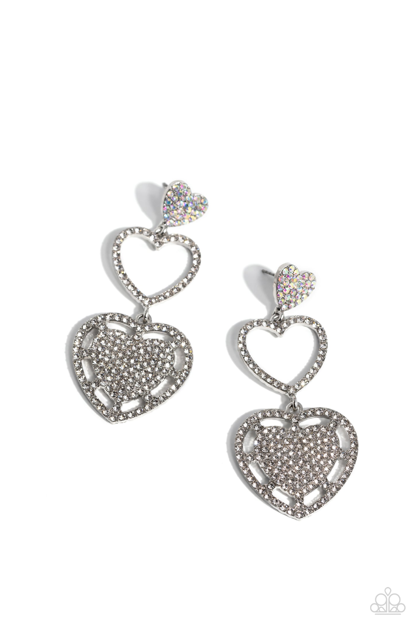 Couples Celebration White Heart Post Earring - Paparazzi Accessories An iridescent-encrusted silver heart, white rhinestone-encrusted silver heart frame, and white rhinestone-encrusted layered heart frame gradually increase in size as they delicately interconnect and stack into a dazzling lure for an elegant effervescence. Earring attaches to a standard post fitting. Due to its prismatic palette, color may vary. Sold as one pair of post earrings. SKU: P5PO-WTXX-387XX