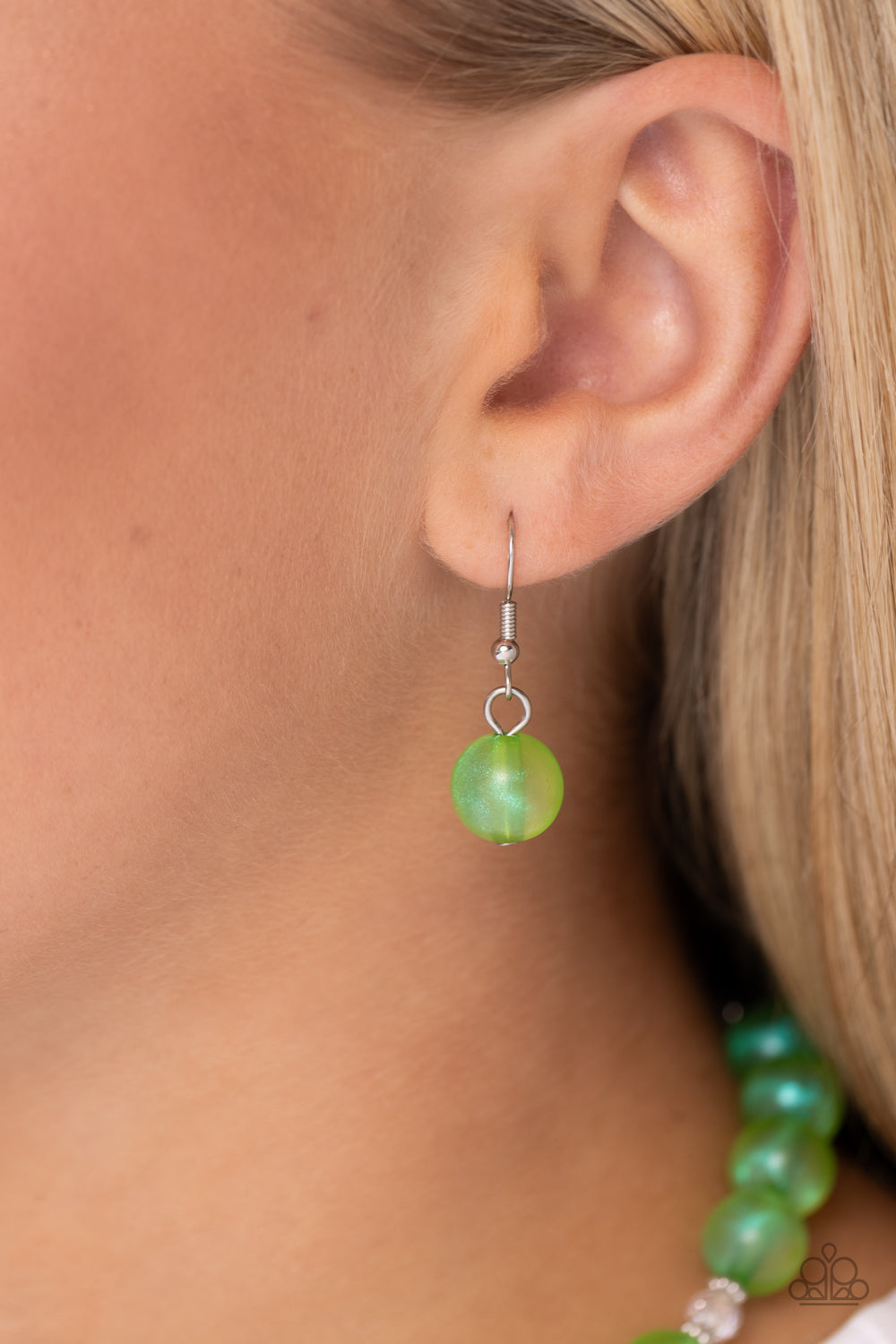 Timelessly Tantalizing Green Necklace - Paparazzi Accessories Infused with dainty silver accents and faceted clear beads, a collection of Kohlrabi opalescent beads, brushed in an iridescent shimmer are threaded along an invisible wire below the collar for a timeless look. Features an adjustable clasp closure. Due to its prismatic palette, color may vary. Sold as one individual necklace. Includes one pair of matching earrings. Sku: P2WH-GRXX-399XX