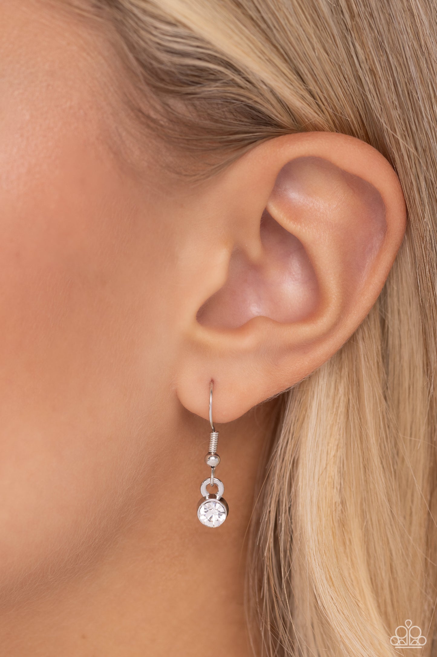 Your Number One Follower White Necklace - Paparazzi Accessories Dangling from a collection of oversized, curved links connected to a silver link chain, a locket-inspired pendant rests in the shape of a triangle. Embossed in white rhinestones, a #1 gleams from the center of the pendant for a sports-inspired finish. Features an adjustable clasp closure. Sold as one individual necklace. Includes one pair of matching earrings. P2DA-WTXX-238XX