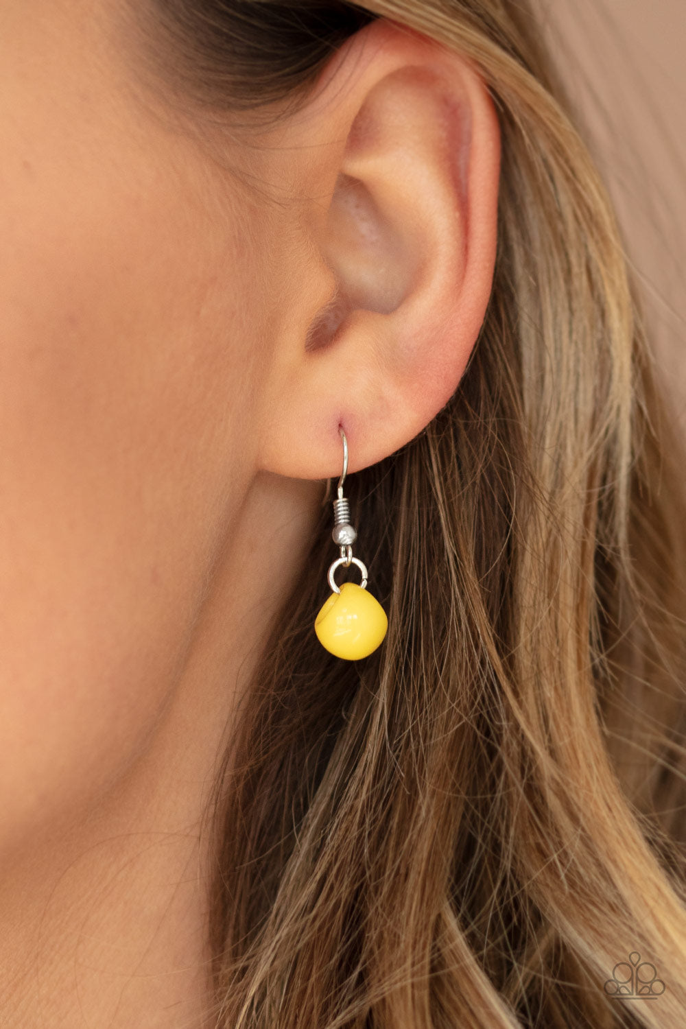 Bubbly Brilliance - Yellow Item #N737 A bubbly collection of imperfect silver, opaque, and yellow beads are threaded along an invisible wire below the collar, creating a colorful cluster. Features an adjustable clasp closure. All Paparazzi Accessories are lead free and nickel free! Sold as one individual necklace. Includes one pair of matching earrings.