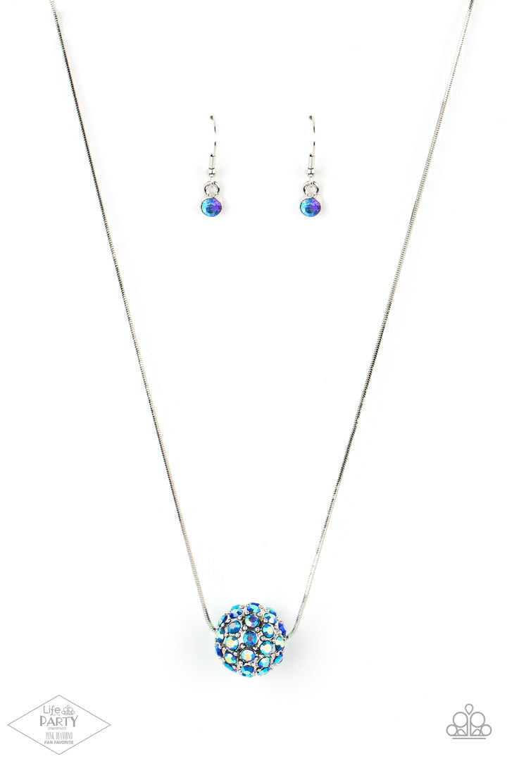 Come Out of Your BOMBSHELL Multi Necklace - Paparazzi Accessories Bedazzled in stellar iridescent rhinestones, a dramatic silver bead slides along a sleek silver chain below the collar for a statement-making look. Due to its prismatic palette, color may vary. Features an adjustable clasp closure. Sold as one individual necklace. Includes one pair of matching earrings.