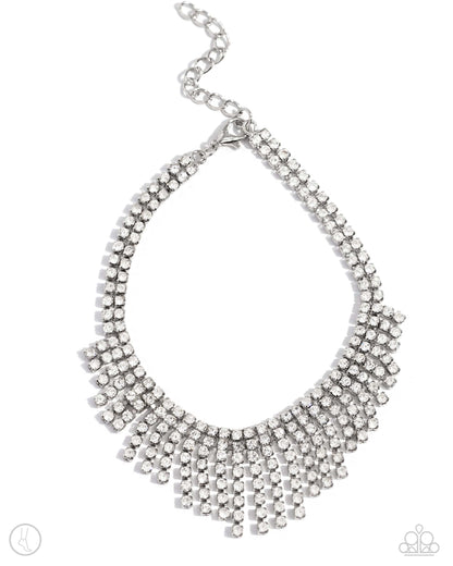 Curtain Confidence White Rhinestone Anklet - Paparazzi Accessories A sassy curtain of mismatched white rhinestone-encrusted silver box chains tapers from the bottom of a double-stranded dramatic row of glassy white rhinestones delicately pressed in silver square fittings. The exaggerated fringe cascades around the ankle, resulting in a dauntless attitude that demands attention with every swish. Features an adjustable clasp closure. Sold as one individual anklet. P9AN-WTXX-049XX