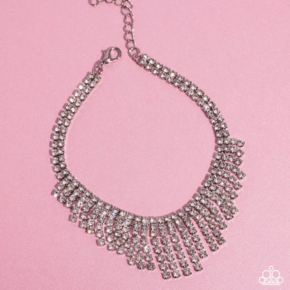 Curtain Confidence White Rhinestone Anklet - Paparazzi Accessories A sassy curtain of mismatched white rhinestone-encrusted silver box chains tapers from the bottom of a double-stranded dramatic row of glassy white rhinestones delicately pressed in silver square fittings. The exaggerated fringe cascades around the ankle, resulting in a dauntless attitude that demands attention with every swish. Features an adjustable clasp closure. Sold as one individual anklet. P9AN-WTXX-049XX