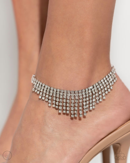 Curtain Confidence White Rhinestone Anklet - Paparazzi Accessories A sassy curtain of mismatched white rhinestone-encrusted silver box chains tapers from the bottom of a double-stranded dramatic row of glassy white rhinestones delicately pressed in silver square fittings. The exaggerated fringe cascades around the ankle, resulting in a dauntless attitude that demands attention with every swish. Features an adjustable clasp closure. Sold as one individual anklet. P9AN-WTXX-049XX