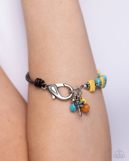 Daring Dragonfly Yellow Clasp Bracelet - Paparazzi Accessories  Featuring a brown half-leather band, a collection of silver floral beads alternates between yellow and turquoise stones for an earthy display around the wrist. A silver dragonfly dances alongside a yellow and orange stone at the end of the hoop for additional whimsical charm. Features a clasp closure. As the stone elements in this piece are natural, some color variation is normal.  Sold as one individual bracelet.  P9SE-YWXX-174XX