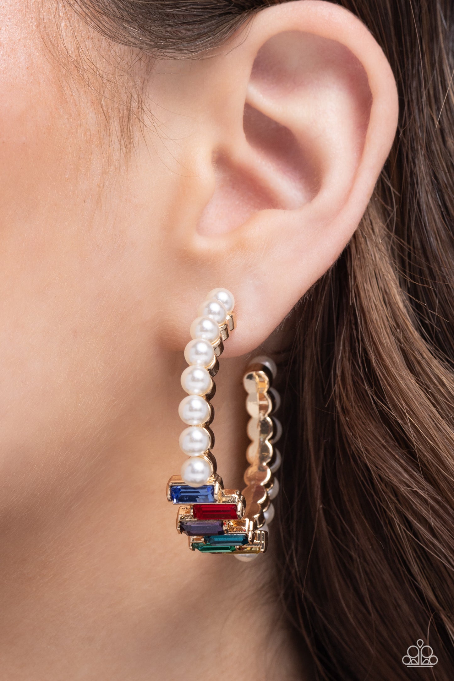 Modest Maven Gold Hoop Earring - Paparazzi Accessories Floating atop sleek gold fittings, a glamorous collection of classic white pearls, interrupted by a collection of staggered multicolored emerald-cut gems, delicately coalesces around a gold hoop for a sparkly statement. Earring attaches to a standard post fitting. Hoop measures approximately 1 3/4" in diameter. Sold as one pair of hoop earrings. SKU: P5HO-GDXX-320XX
