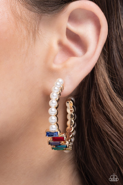 Modest Maven Gold Hoop Earring - Paparazzi Accessories Floating atop sleek gold fittings, a glamorous collection of classic white pearls, interrupted by a collection of staggered multicolored emerald-cut gems, delicately coalesces around a gold hoop for a sparkly statement. Earring attaches to a standard post fitting. Hoop measures approximately 1 3/4" in diameter. Sold as one pair of hoop earrings. SKU: P5HO-GDXX-320XX