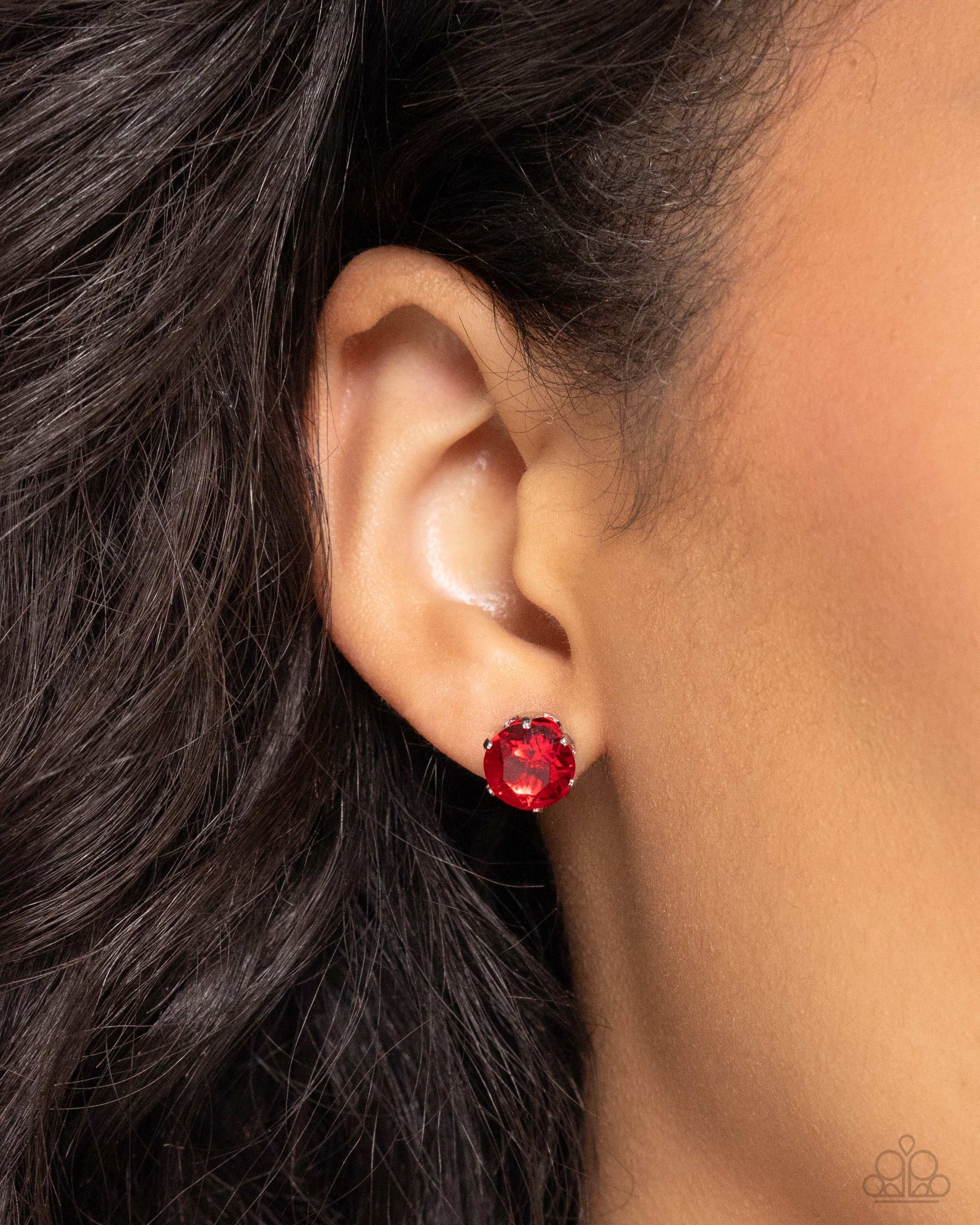 Breathtaking Birthstone Ruby Red Post Earring - Paparazzi Accessories  A sparkling ruby rhinestone is nestled inside a classic silver frame for a beautiful birthstone-inspired display. Earring attaches to a standard post fitting.  Sold as one pair of post earrings.  P5PO-RDXX-053UB