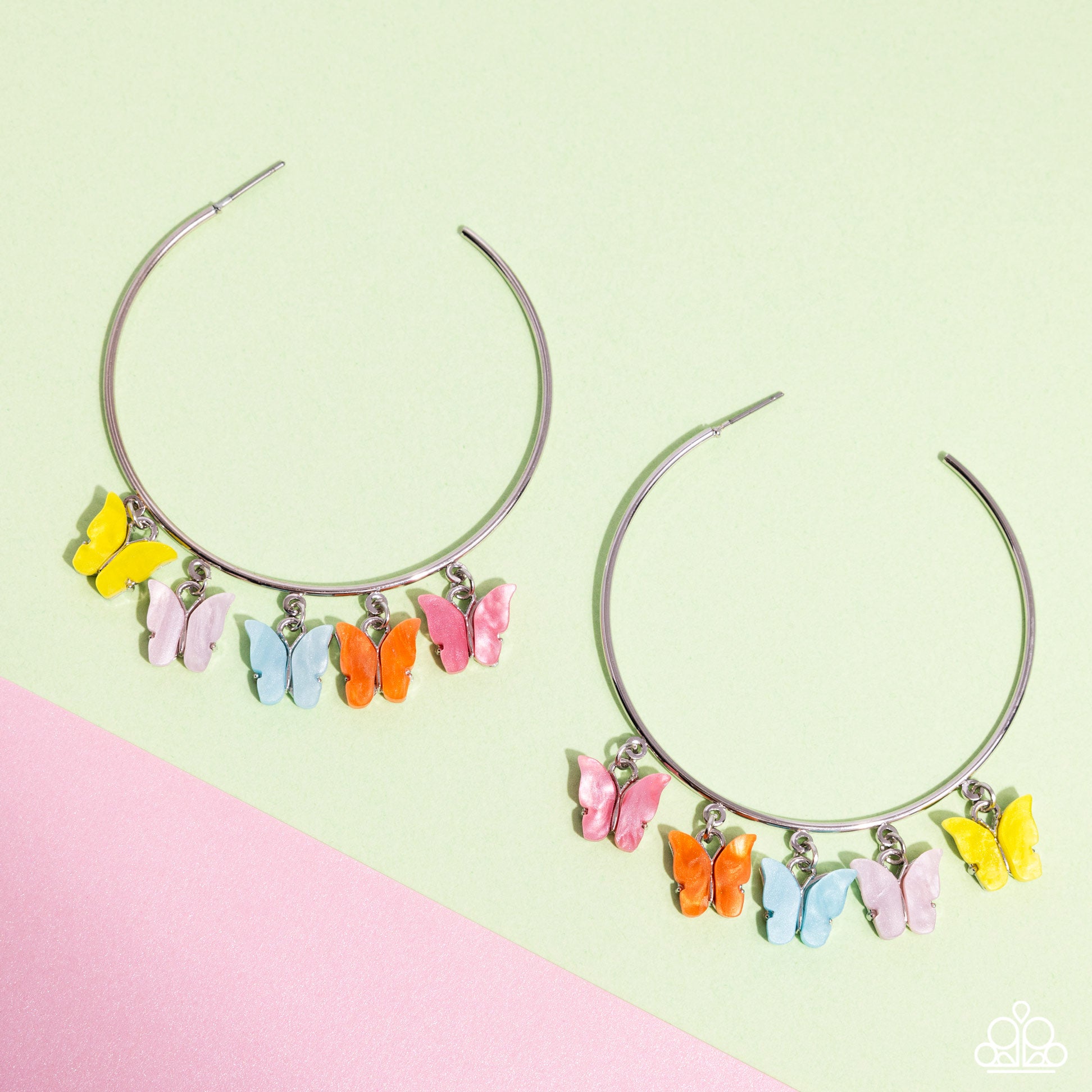 Bemusing Butterflies Multi Hoop Earring - Paparazzi Accessories Attached along an oversized silver hoop, a collection of different colored butterflies flutter and fly along the ear for a whimsical finish. Earring attaches to a standard post fitting. Hoop measures approximately 2 1/4" in diameter. Pattern of colors may vary. Sold as one pair of hoop earrings. P5HO-MTXX-104XX