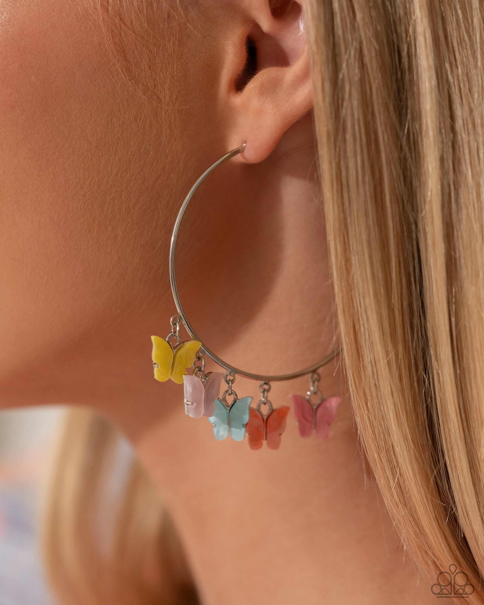 Bemusing Butterflies Multi Hoop Earring - Paparazzi Accessories Attached along an oversized silver hoop, a collection of different colored butterflies flutter and fly along the ear for a whimsical finish. Earring attaches to a standard post fitting. Hoop measures approximately 2 1/4" in diameter. Pattern of colors may vary. Sold as one pair of hoop earrings. P5HO-MTXX-104XX