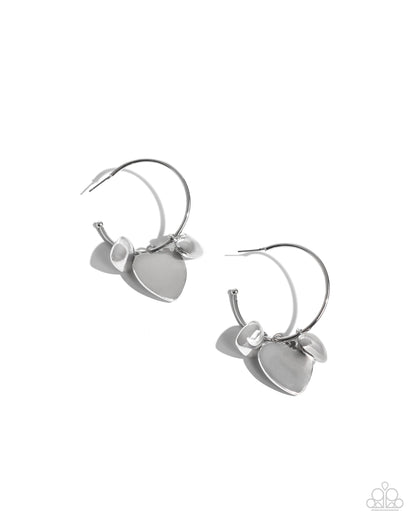 Casually Crushing Silver Heart Hoop Earring - Paparazzi Accessories  Featuring various textures, a trio of silver hearts in varying sizes cascades from a thin silver hoop for a romantic statement. Earring attaches to a standard post fitting. Hoop measures approximately 1 1/2" in diameter.  Sold as one pair of hoop earrings.  SKU: P5HO-SVXX-387XX