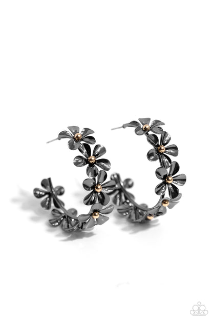 Floral Flamenco Black Flower Hoop Earring - Paparazzi Accessories  Featuring gold bead centers, metallic gunmetal flowers whimsically curl around the ear for a neutral floral display. Earring attaches to a standard post fitting. Hoop measures approximately 1 1/2" in diameter.  Sold as one pair of hoop earrings.  SKU: P5HO-BKXX-275XX