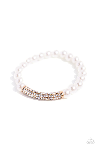 Elegance Embodied Gold Stretch Bracelet - Paparazzi Accessories  Infused along an invisible elastic string, glossy white pearls and a white rhinestone-encrusted gold fitting stand out along the wrist for a refined finish.  Sold as one individual bracelet.  P9RE-GDXX-414XX