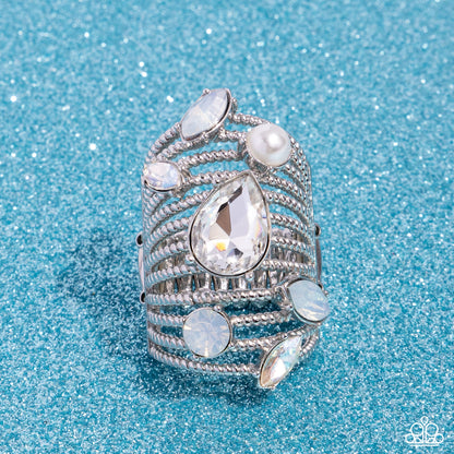 Treasure Tapestry White Ring - Paparazzi Accessories Featuring a dazzling array of round, teardrop, and marquise-cut gems, pearls, and rhinestones in multicolored white hues, row after row of twisted silver bands stack up and across the finger for a knockout look. Features a stretchy band for a flexible fit. Sold as one individual ring. P4ST-WTXX-043XX