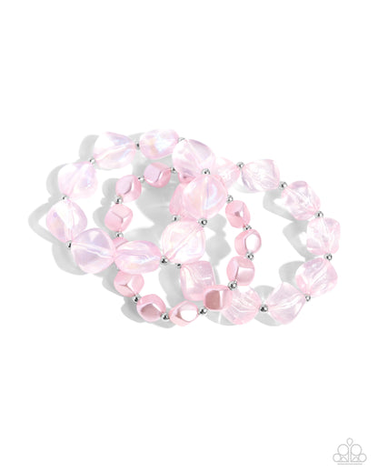 Glittery Gala Pink Stretch Bracelet - Paparazzi Accessories Cubed baby pink pearls join a strand of baby pink acrylics and glittery acrylics that alternate with silver beads along elastic stretchy bands around the wrist for a sweet stack. Sold as one set of three bracelets. SKU: P9ST-PKXX-028VO Get The Complete Look! Necklace: "Cubed Cameo - Pink" (Sold Separately)