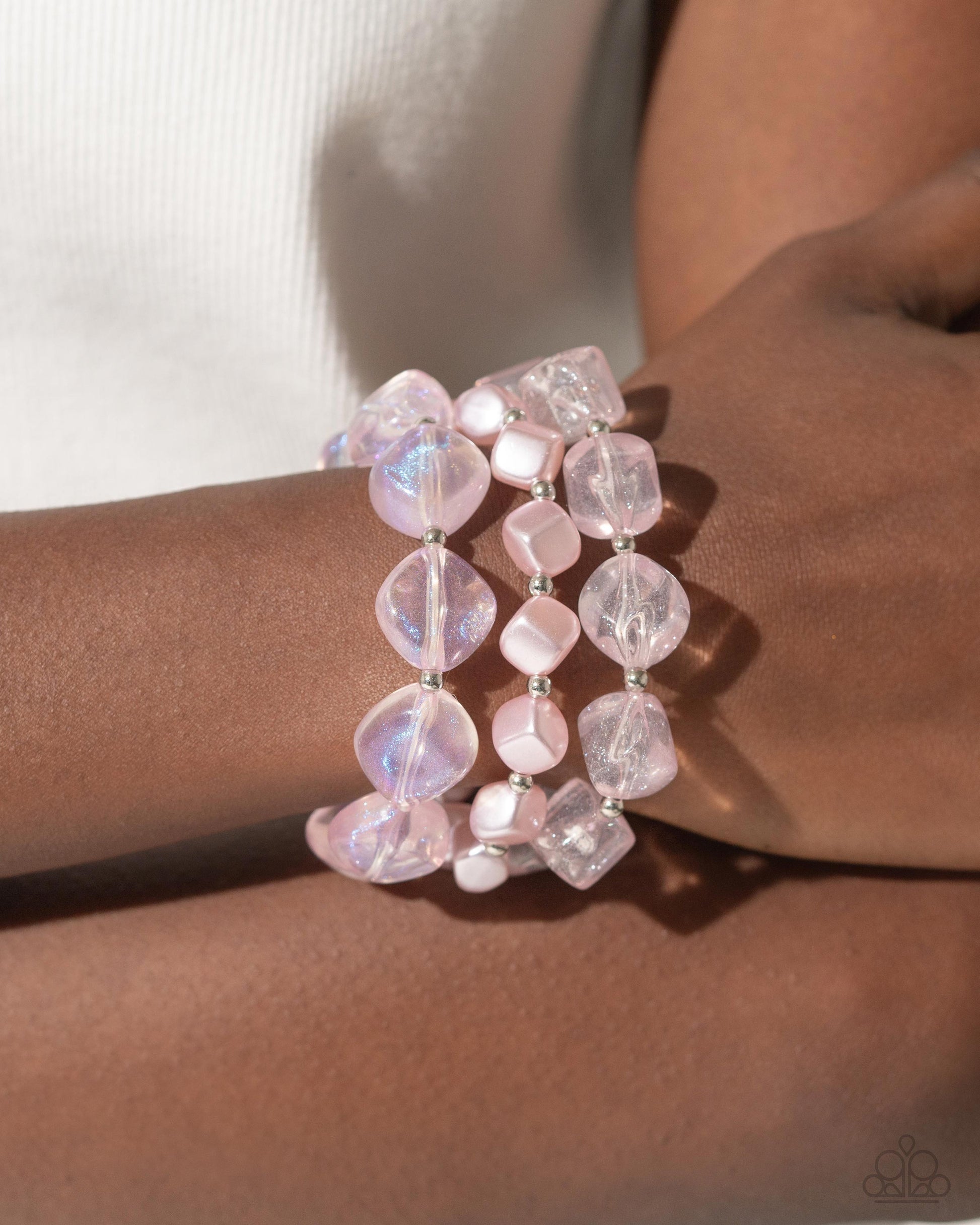 Glittery Gala Pink Stretch Bracelet - Paparazzi Accessories Cubed baby pink pearls join a strand of baby pink acrylics and glittery acrylics that alternate with silver beads along elastic stretchy bands around the wrist for a sweet stack. Sold as one set of three bracelets. SKU: P9ST-PKXX-028VO Get The Complete Look! Necklace: "Cubed Cameo - Pink" (Sold Separately)
