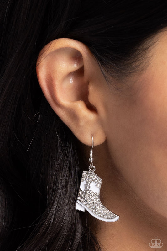 Boot Scootin Bling White Earring - Paparazzi Accessories   Infused with glistening white rhinestones, high-sheen silver cowboy boots cascade from the ear for a Western-inspired statement. Earring attaches to a standard fishhook fitting.  Sold as one pair of earrings.  SKU: P5SE-WTXX-226XX