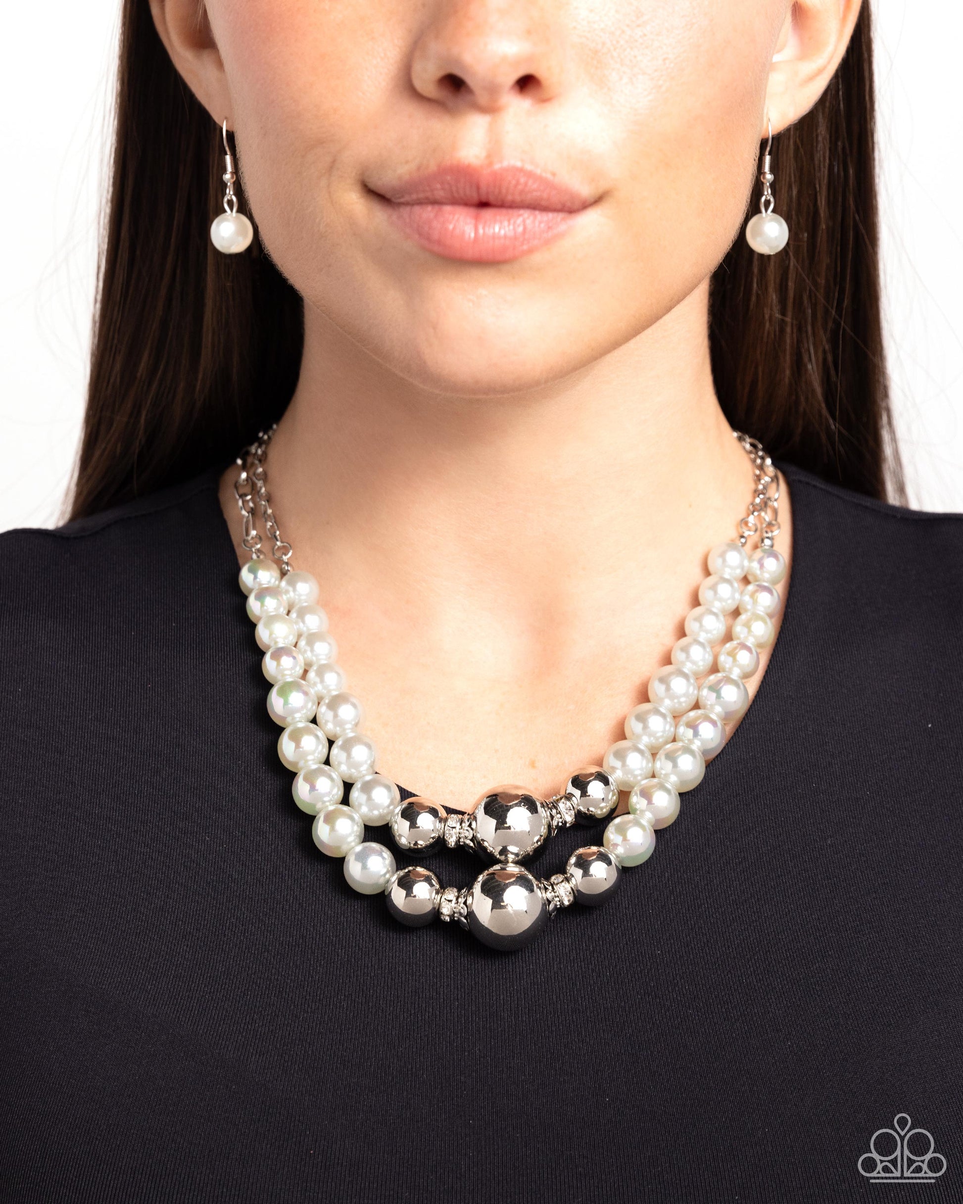 Ballroom Balance Silver Necklace - Paparazzi Accessories Infused along a silver paperclip and classic silver chain, a collection of glossy gray pearls and high-sheen silver beads in various sizes cascade around the collar in layers for an elegant display. Features an adjustable clasp closure. Sold as one individual necklace. Includes one pair of matching earrings. SKU: P2ST-SVXX-220XX