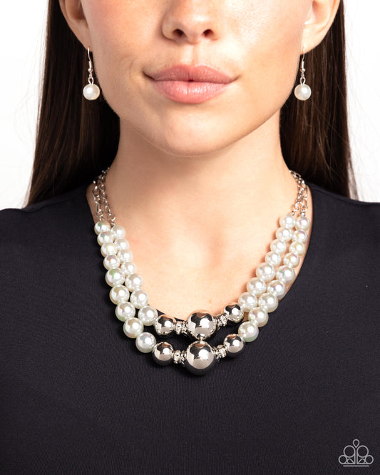 Ballroom Balance Silver Necklace - Paparazzi Accessories Infused along a silver paperclip and classic silver chain, a collection of glossy gray pearls and high-sheen silver beads in various sizes cascade around the collar in layers for an elegant display. Features an adjustable clasp closure. Sold as one individual necklace. Includes one pair of matching earrings. SKU: P2ST-SVXX-220XX