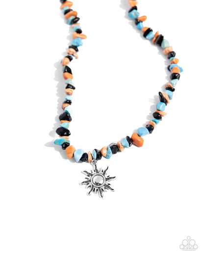 Dancing In The Sunlight Black Unisex Necklace - Paparazzi Accessories Infused along an invisible string, chiseled black, orange, green, and turquoise stone pebbles loop around the neckline. A tactile-detailed silver sunburst pendant hangs from the bottom of the stony display for additional sunny charm. Features an adjustable clasp closure. As the stone elements in this piece are natural, some color variation is normal. Sold as one individual necklace. SKU: P2SE-URBK-194XX