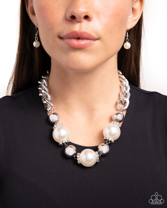 Generously Glossy White Pearl Necklace - Paparazzi Accessories Oversized, high-sheen silver curb chain links gives way to a collection of oversized white pearls, silver beads, and white rhinestone-encrusted silver rings for a glamorously glossy look. Features an adjustable clasp closure. Sold as one individual necklace. Includes one pair of matching earrings. SKU: P2ST-WTXX-155XX