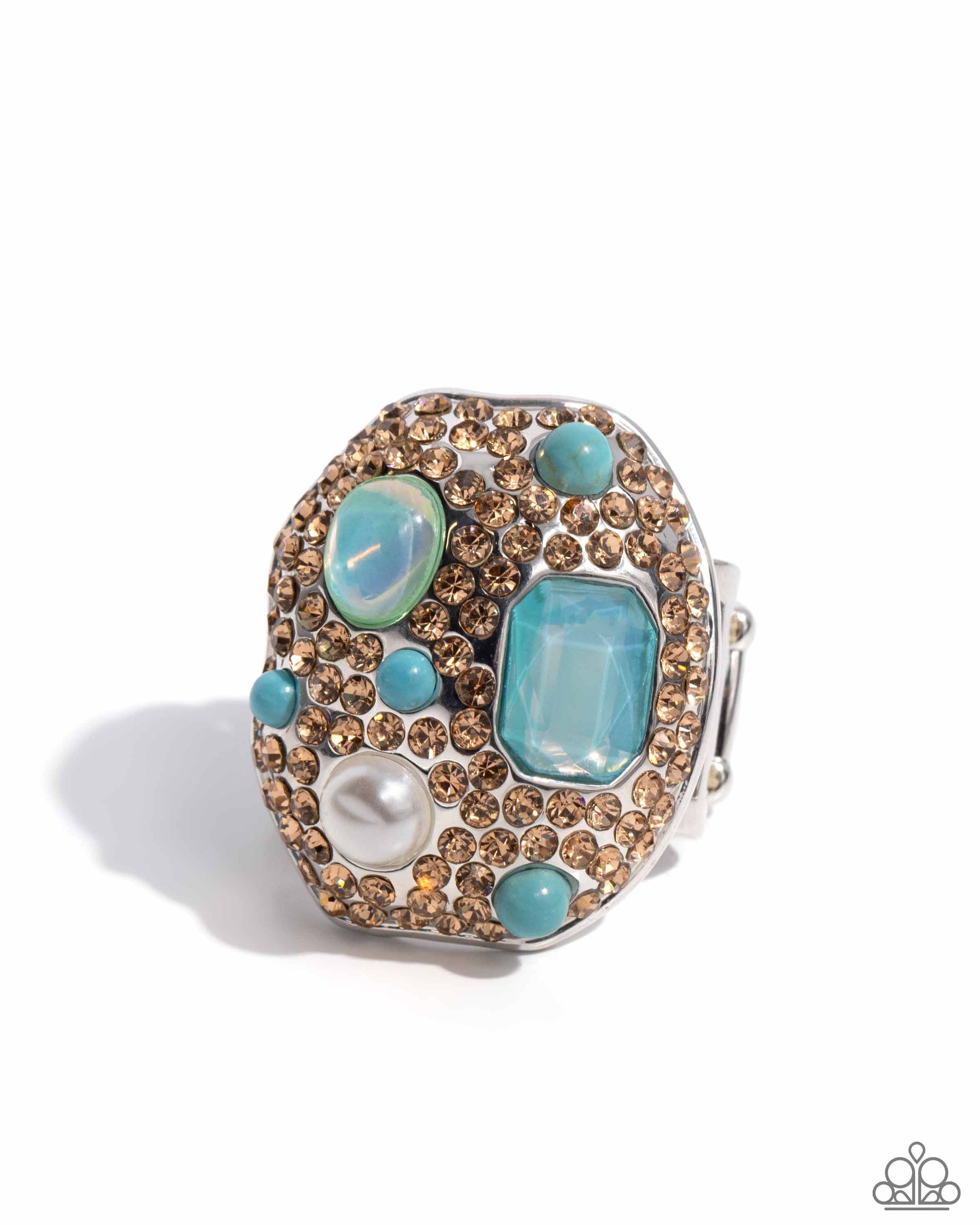 Active Artistry Blue Ring (May 2024 LOP) - Paparazzi Accessories  Item #P4ST-BLXX-030XX   Embellished in light-colored topaz rhinestones, an oval abstract silver ring glitters atop the finger. Turquoise beads, a white pearl, an emerald-cut aquamarine gem, and an aquamarine iridescent oval bead create additional color and shine. Features a stretchy band for a flexible fit. Due to its prismatic palette, color may vary.  Sold as one individual ring.
