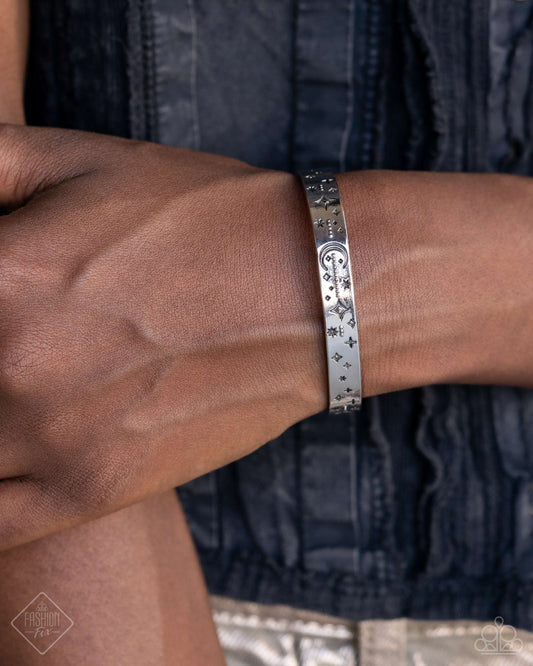 Celestial Captain - Silver Item #P9WH-SVXX-261YC   Delicately studded and embossed in a collision of stellar patterns and textures, including stars and crescent moons, a glistening silver cuff wraps around the wrist for a bold celestial look.  Sold as one individual bracelet.