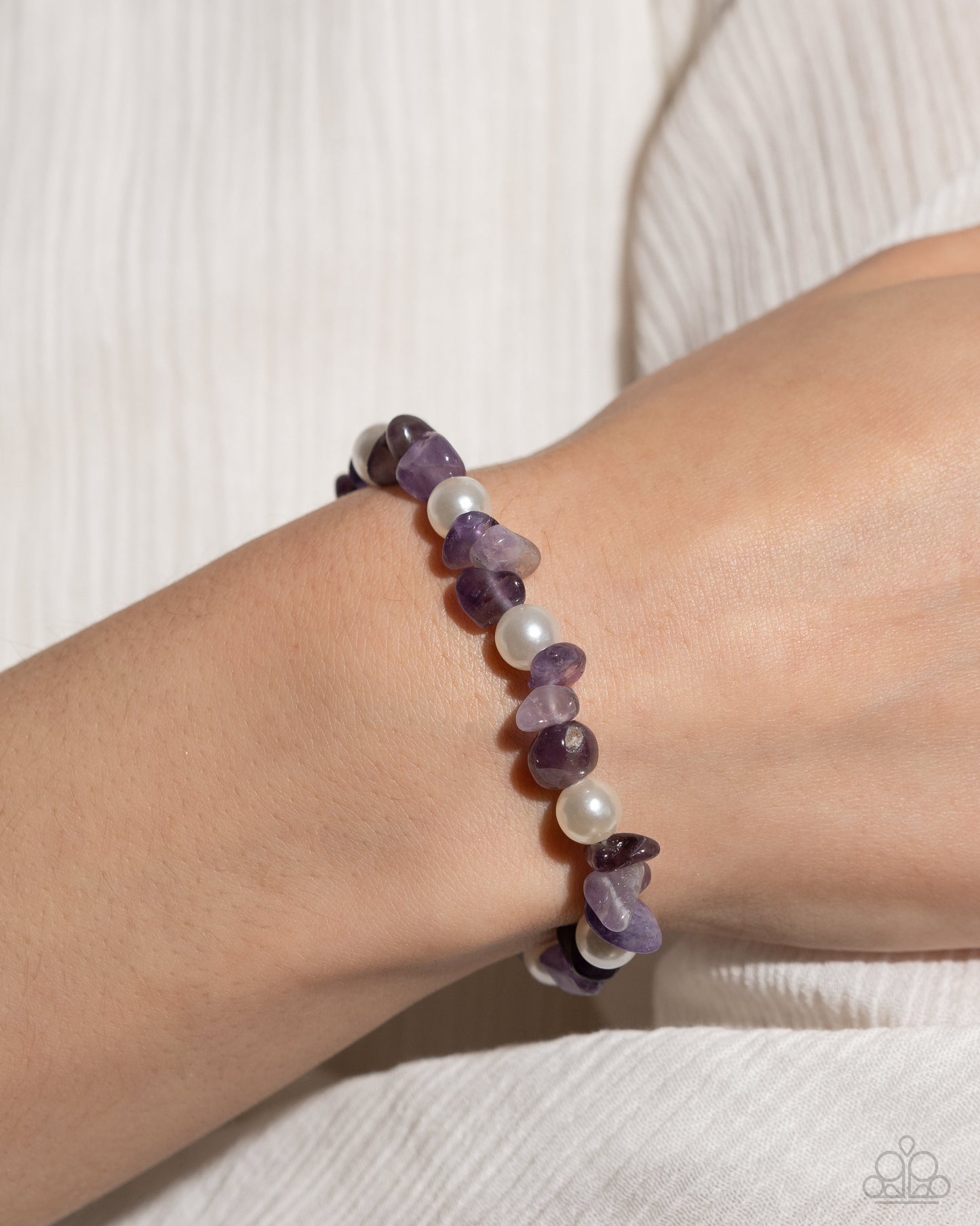 Robust Refinement Purple Stretch Bracelet - Paparazzi Accessories  A collection of amethyst stones and white pearls are infused along an elastic stretchy band for a refined, tranquil statement. As the stone elements in this piece are natural, some color variation is normal.  Sold as one individual bracelet.  SKU: P9SE-PRXX-204WV   Get The Complete Look! Necklace: "Nostalgically Noble - Purple" (Sold Separately)