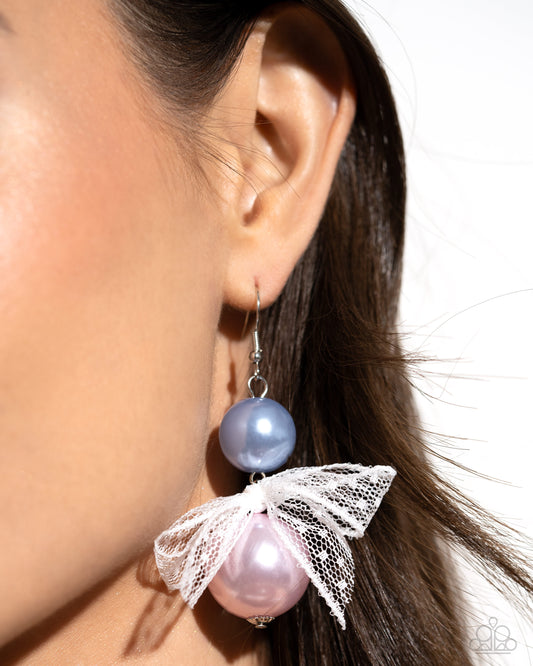 Elegance Ease Multi Pearl Earring - Paparazzi Accessories Two glossy pearls one in blue and one in pink stack atop one another while an airy, chiffon white ribbon is tied in the center of the pearls for a refined finish. Earring attaches to a standard fishhook fitting. Sold as one pair of earrings. SKU: P5RE-MTXX-135VV Get The Complete Look! Bracelet: "Girly Glam - Multi" (Sold Separately)