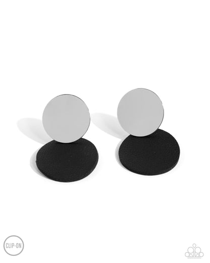 Leather Leader Black Clip-On Earring - Paparazzi Accessories  An oversized silver disc gives way to an even larger disc of black leather for a badlands basic. Earring attaches to a standard clip-on fitting.  Sold as one pair of clip-on earrings.  SKU: P5CO-BKXX-095XX