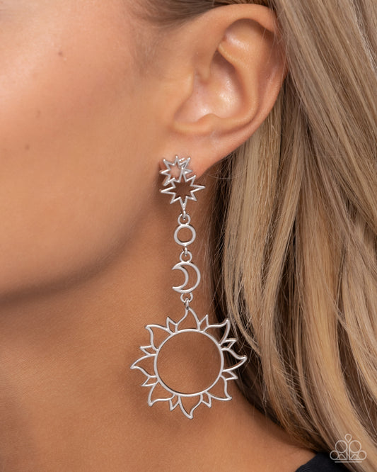 Celestial Chic Silver Post Earring - Paparazzi Accessories Three-dimensional silver star frames that stack atop one another give way to an airy silver crescent moon and oversized silver sun pendant as they delicately link into a stellar tassel, resulting in an out-of-this-world fashion. Earring attaches to a standard post fitting. Sold as one pair of post earrings. SKU: P5PO-SVXX-281XX