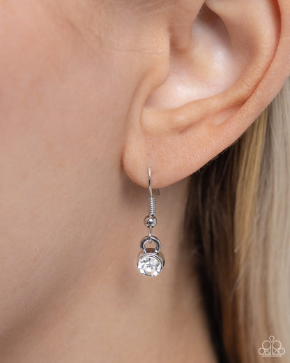 Soft-Hearted Style Black Heart Necklace - Paparazzi Accessories A gleaming black acrylic heart is nestled inside an airy, white rhinestone-encrusted heart frame, creating a charming pendant at the bottom of an exaggerated silver paperclip chain. A quintet of white gems interrupts the silver paperclip chain for additional refinement and shimmer. Features a toggle clasp closure. Sold as one individual necklace. Includes one pair of matching earrings. SKU: P2RE-BKXX-483XX