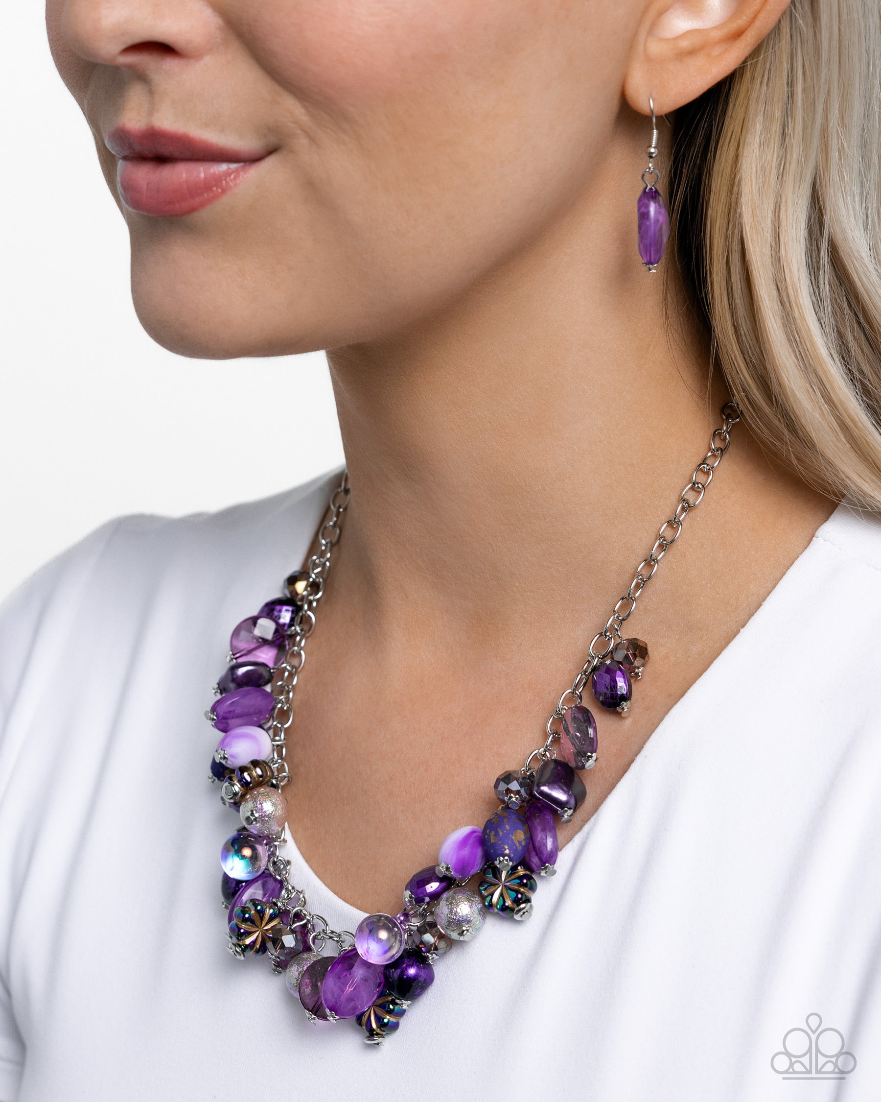 Offbeat Ofrenda Purple Necklace - Paparazzi Accessories  A collection of various purple multicolored beads in various opacities sway and flutter below the neckline from a classic silver chain. Oil spill-dipped floral beads are added along the purple display for a finishing touch of color and charm. Features an adjustable clasp closure. Due to its prismatic palette, color may vary.  Sold as one individual necklace. Includes one pair of matching earrings.  P2WH-PRXX-451XX