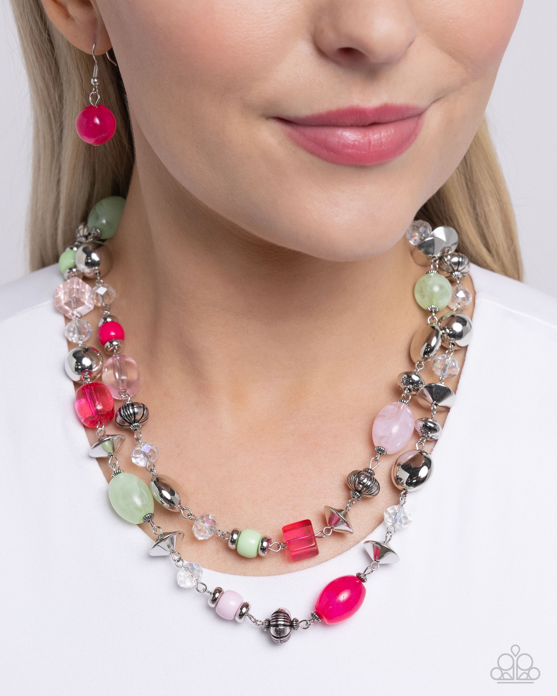 Playful Past Pink Necklace - Paparazzi Accessories  Featuring a variety of opacities, a collection of Pink Peacock, light pink, and Mint beads join various textured silver beads and faceted iridescent beads along the neckline in two layers for a playfully, colorful look. Features an adjustable clasp closure. Due to its prismatic palette, color may vary.  Sold as one individual necklace. Includes one pair of matching earrings.  SKU: P2ST-PKXX-179XX