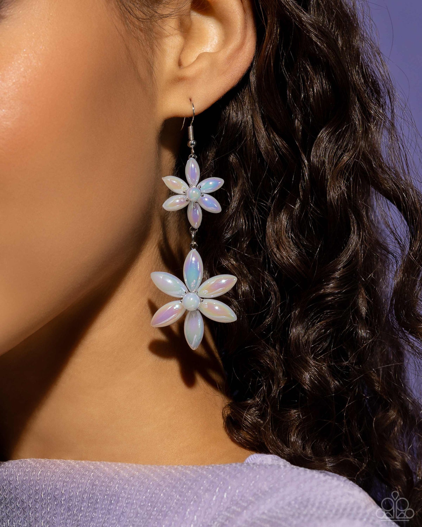 Pearl Posy White Flower Earring - Paparazzi Accessories  Sleek iridescent pearly flowers featuring glassy white pearl centers gradually increase in size as they fall from the ear, infusing the sophisticated design with whimsical movement. Earring attaches to a standard fishhook fitting. Due to its prismatic palette, color may vary.  Sold as one pair of earrings.  P5WH-WTXX-280XX