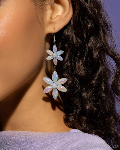 Pearl Posy White Flower Earring - Paparazzi Accessories  Sleek iridescent pearly flowers featuring glassy white pearl centers gradually increase in size as they fall from the ear, infusing the sophisticated design with whimsical movement. Earring attaches to a standard fishhook fitting. Due to its prismatic palette, color may vary.  Sold as one pair of earrings.  P5WH-WTXX-280XX