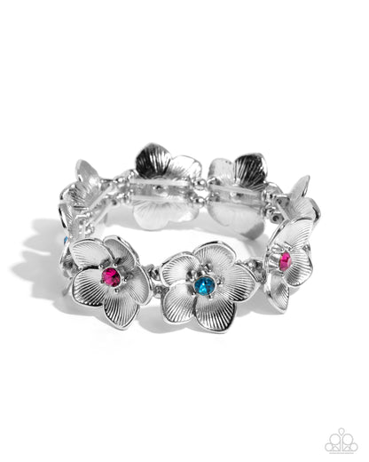 General Grandeur Blue Flower Stretch Bracelet - Paparazzi Accessories Featuring blue and fuchsia gem centers, highly-textured silver flowers alternate and stretch along elastic stretchy bands around the wrist for a whimsical centerpiece. Sold as one individual bracelet. SKU: P9RE-BLXX-258XX