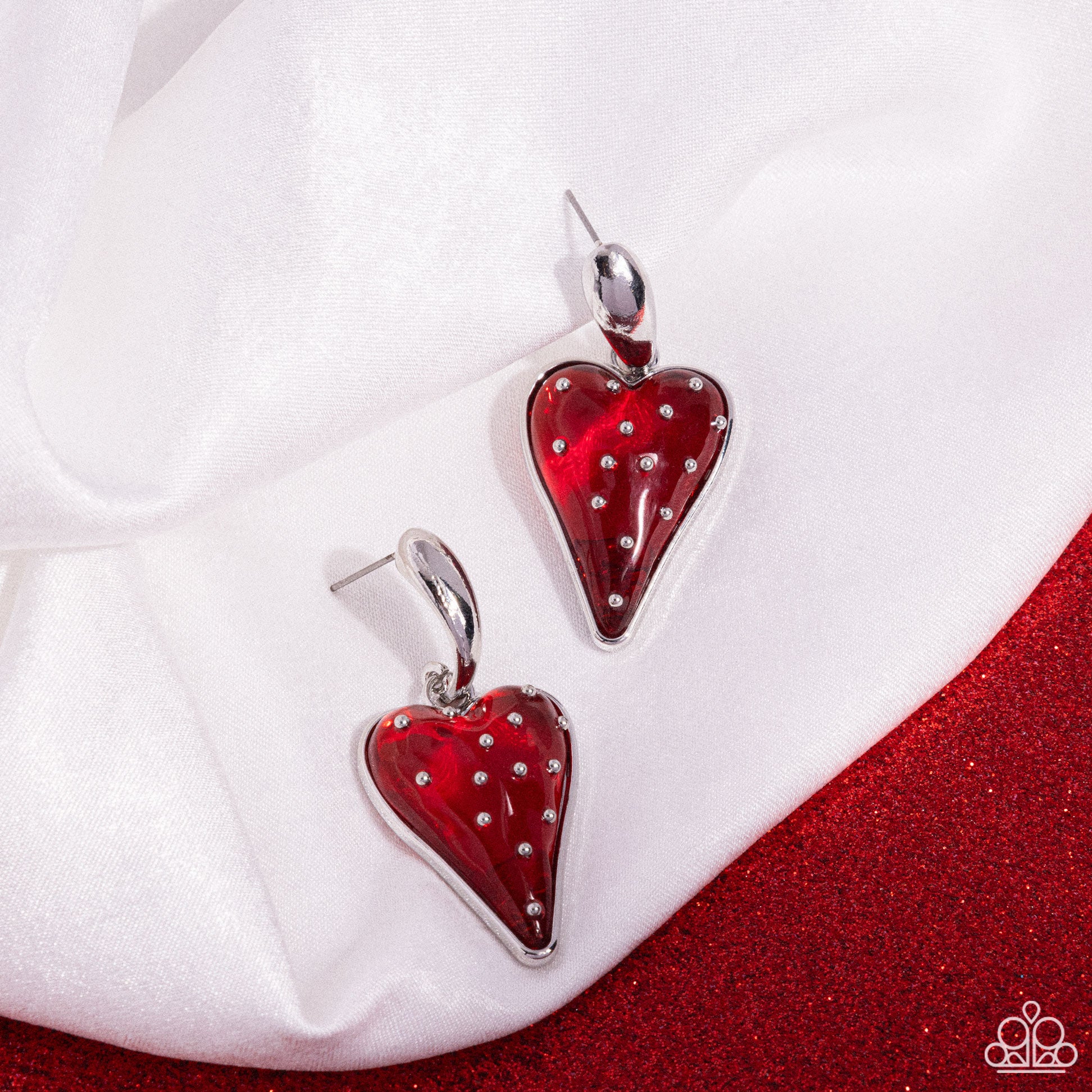 Glossy Goodwill Red Heart Earring - Paparazzi Accessories  A curved silver post gives way to a glossy jelly-like red strawberry pendant embellished with silver "seeds" for a sweet, summery statement. Earring attaches to a standard post fitting.  Sold as one pair of post earrings.  P5PO-RDXX-069XX
