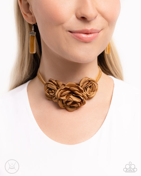 Home-Grown Homage Brown Flower Choker Necklace - Paparazzi Accessories  Light brown satin petals form into a decadent trio of rosettes atop a sleek satin ribbon in the same hue along the collar for a whimsical display. Features an adjustable clasp closure.  Sold as one individual choker necklace. Includes one pair of matching earrings.  P2CH-BNXX-032XX