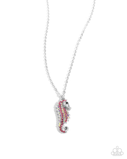 Seahorse Sailor Pink Necklace - Paparazzi Accessories  Gliding along a dainty silver chain, a rose, iridescent, and black rhinestone-embellished silver seahorse pendant shines below the neckline for a chic, coastal look. Features an adjustable clasp closure. Due to its prismatic palette, color may vary.  Sold as one individual necklace. Includes one pair of matching earrings.  P2DA-PKXX-209XX