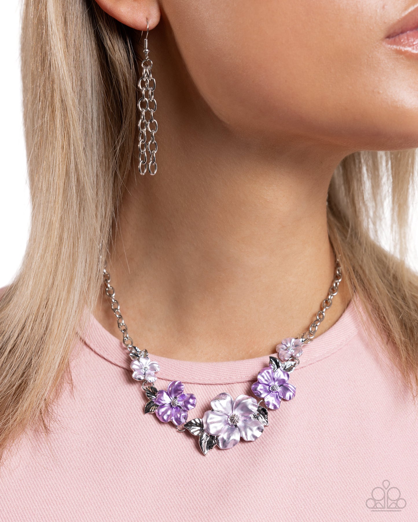 Bouquet Brilliance Purple Flower Necklace - Paparazzi Accessories  Dotted with silver-studded centers, metallic light purple and lavender flowers bloom and alternate along the neckline. Each flower, varying in size, blossoms across a textured collection of silver leaves below the collar, invoking a festive spirit. Features an adjustable clasp closure.  Sold as one individual necklace. Includes one pair of matching earrings.  P2ST-PRXX-176ZR