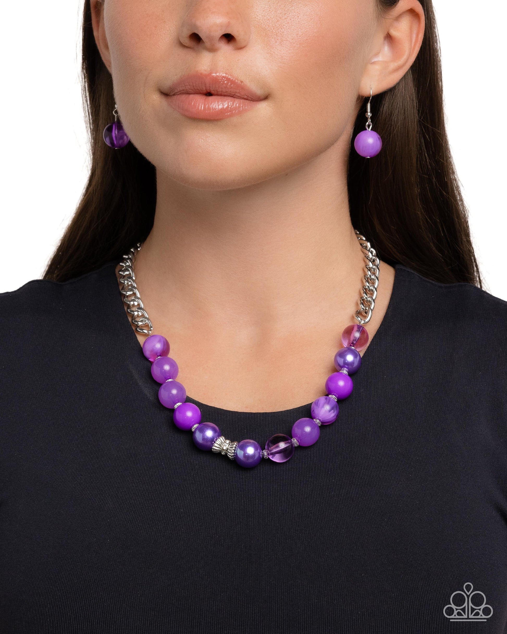 Opulent Opacities Purple Necklace - Paparazzi Accessories A glistening silver curb chain gives way to a collection of purple beads featuring various opacities and iridescent shimmer. Textured ribbed silver beads alternate between each purple bead and collect at the center of the display around a ribbon of white gems for a shimmery finish. Features an adjustable clasp closure. Due to its prismatic palette, color may vary. Includes one pair of matching earrings. P2RE-PRXX-336XX