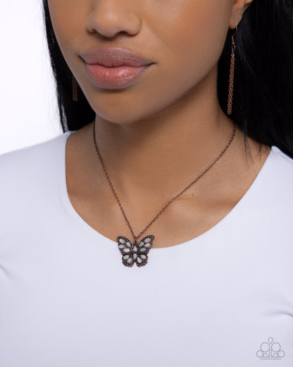Santa Fe Satisfaction Copper Butterfly Necklace - Paparazzi Accessories  Featuring white stones in varying shapes, a copper-studded butterfly flutters along a dainty copper cable chain below the neckline for a whimsically reflective look. Features an adjustable clasp closure. As the stone elements in this piece are natural, some color variation is normal.  Sold as one individual necklace. Includes one pair of matching earrings.  P2SE-CPXX-180XX