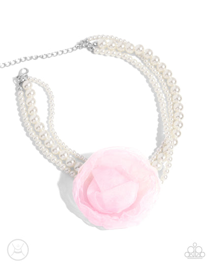 Radiant Rosette Pink Pearl Choker Necklace - Paparazzi Accessories  A trio of glossy white pearly strands in varying sizes coalesce around the collar for a radiant, refined look. An oversized baby pink tulle rosette adorns the center of the pearly strands for a feminine finish. Features an adjustable clasp closure.  Sold as one individual choker necklace. Includes one pair of matching earrings.  P2CH-PKXX-041XX