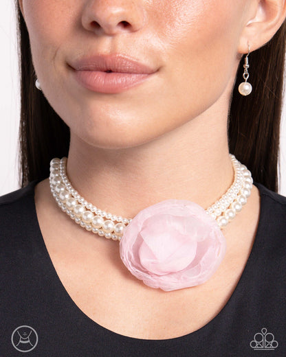 Radiant Rosette Pink Pearl Choker Necklace - Paparazzi Accessories  A trio of glossy white pearly strands in varying sizes coalesce around the collar for a radiant, refined look. An oversized baby pink tulle rosette adorns the center of the pearly strands for a feminine finish. Features an adjustable clasp closure.  Sold as one individual choker necklace. Includes one pair of matching earrings.  P2CH-PKXX-041XX
