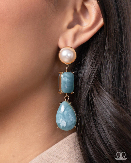 Marbled Masterpiece Blue Post Earring - Paparazzi Accessories  Encased in a gold fitting, a glossy white pearl gives way to a collection of blue-marbled beads for a sophisticated shimmer. Featuring teardrop and emerald style cuts, each blue-marbled bead is delicately encased in gold-pronged frames, further adding a touch of color to the glamorous look. Earring attaches to a standard post fitting.  Sold as one pair of post earrings.  P5PO-BLXX-199DB