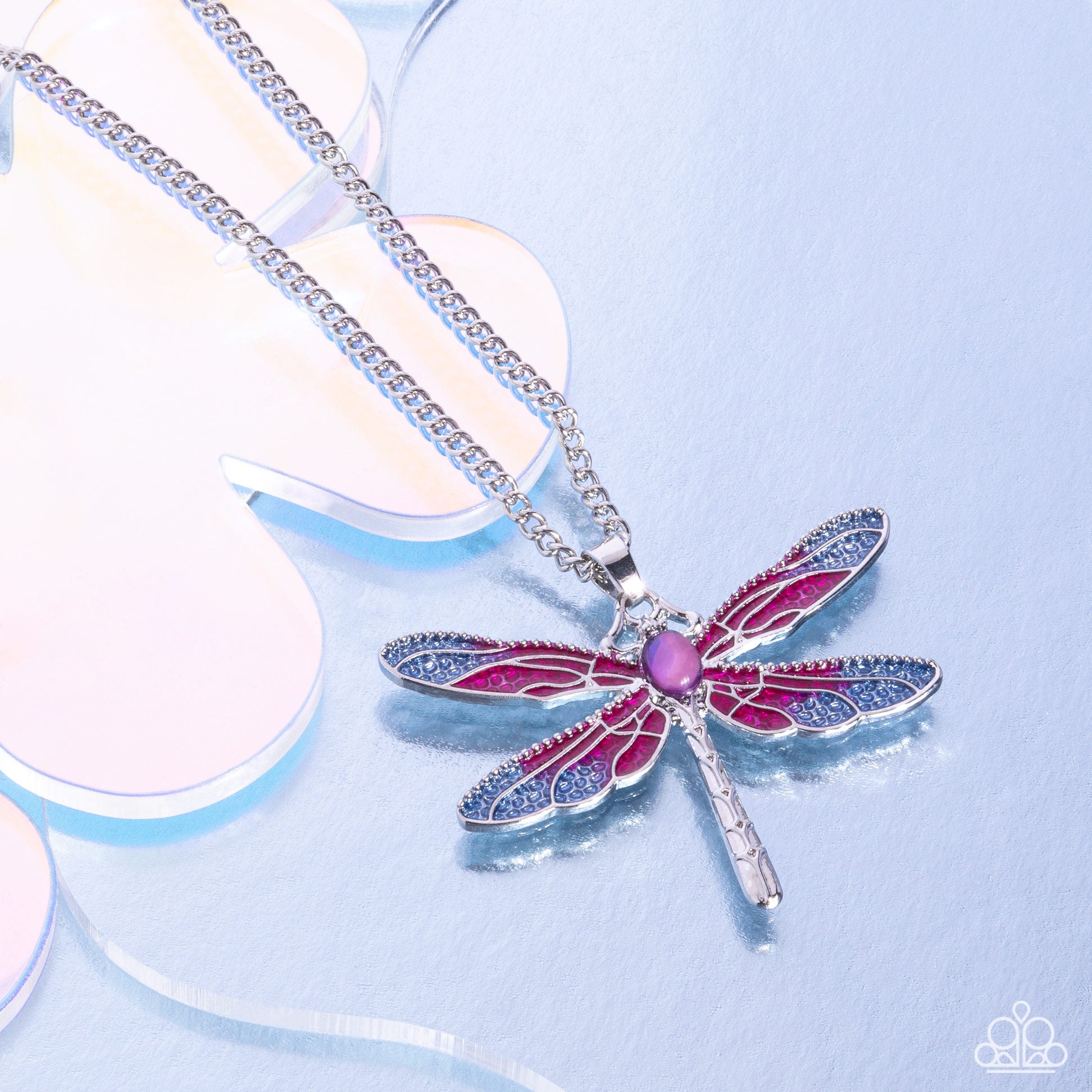 DRAGONFLY to the Sky Purple Necklace - Paparazzi Accessories Featuring a classic silver chain, an Orchid and light blue painted silver dragonfly pendant glides along the neckline for a colorfully rustic centerpiece. An opalescent amethyst oval bead is pressed in the center of the display while textured silver connects and creates the rest of the dragonfly's body for additional eye-catching color and character. Features an adjustable clasp closure. Includes one pair of matching earrings. P2RE-PRXX-331XX